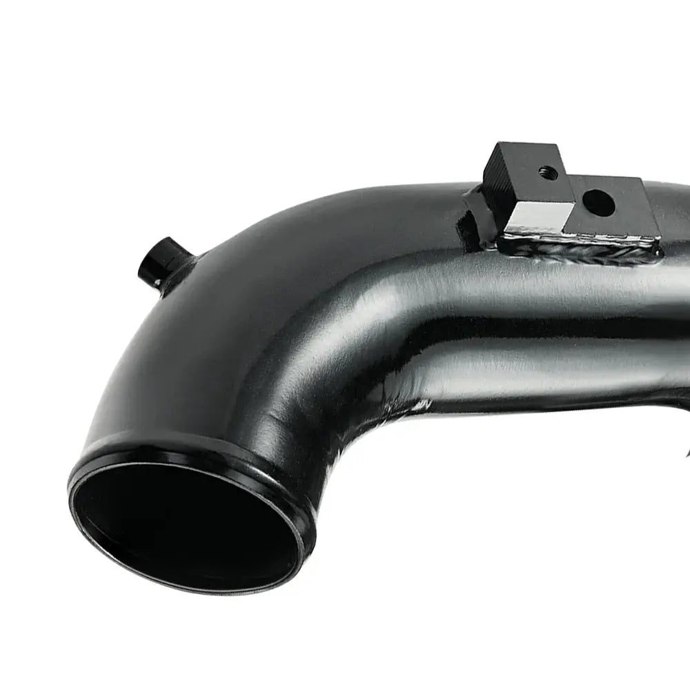 Close-up of the polished mandrel-bent aluminum cold side intercooler pipe for 06-10 6.6 Duramax LBZ LMM, showing welded threaded bungs for sensor connection.