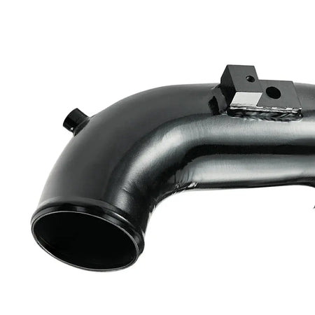 Close-up of the polished mandrel-bent aluminum cold side intercooler pipe for 06-10 6.6 Duramax LBZ LMM, showing welded threaded bungs for sensor connection.